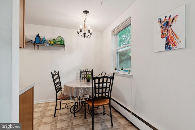 dining room with a chandelier and a baseboard heating unit