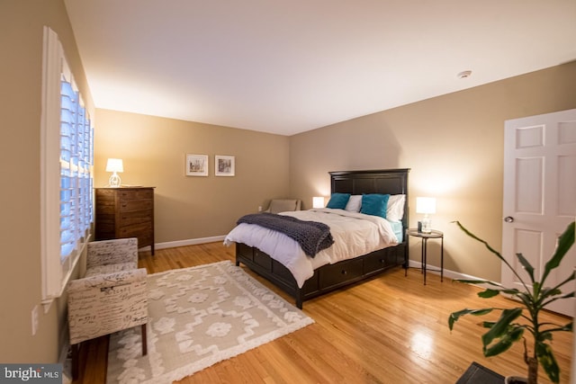 bedroom with wood-type flooring