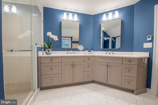 bathroom featuring an enclosed shower and vanity