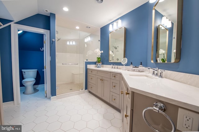 bathroom featuring a shower with door, tile patterned flooring, vanity, vaulted ceiling, and toilet