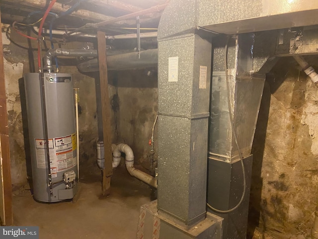 utility room featuring heating unit and water heater