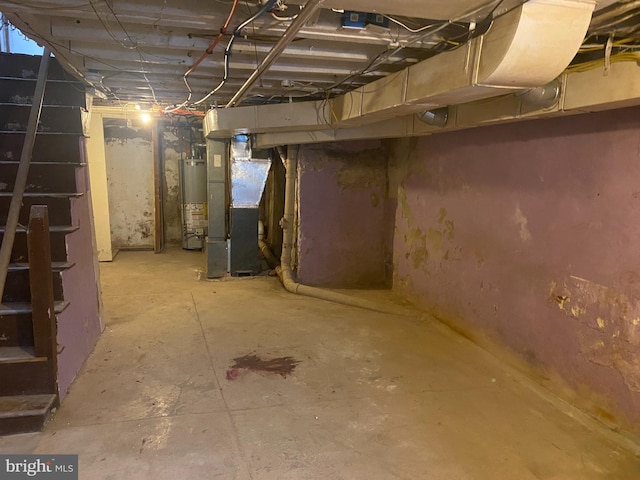 basement featuring heating unit and gas water heater