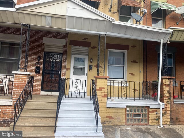 entrance to property with a porch