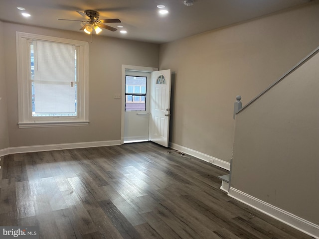 entrance foyer featuring ceiling fan and dark wood-type flooring