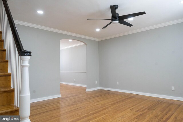 unfurnished room with crown molding, light hardwood / wood-style flooring, and ceiling fan