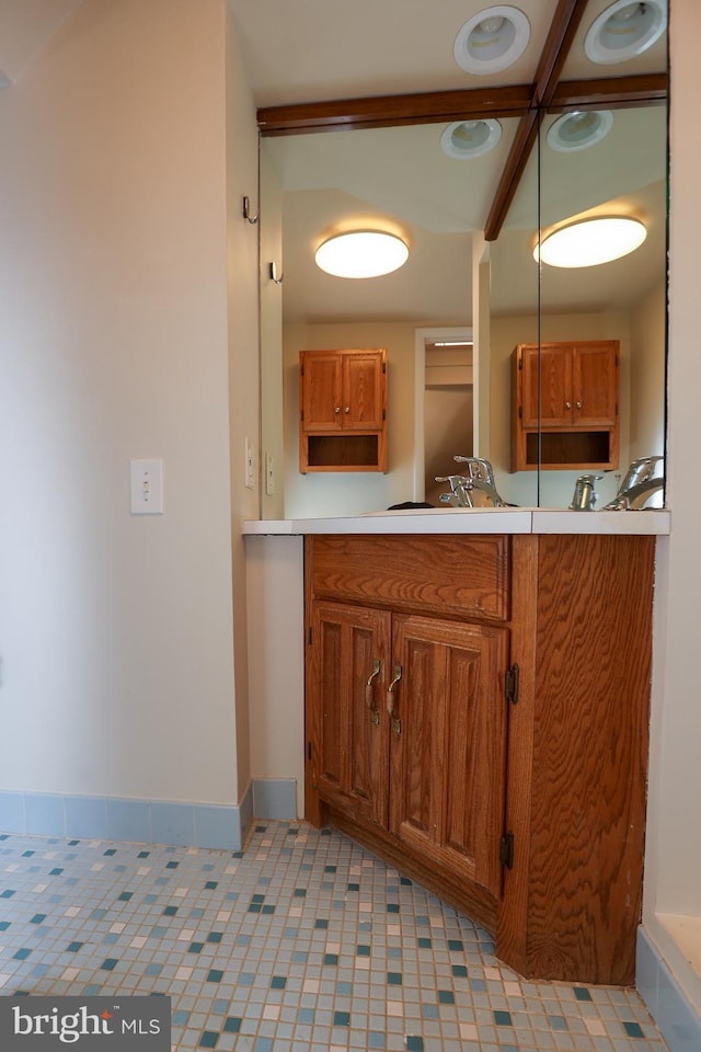 bathroom featuring tile patterned floors and vanity