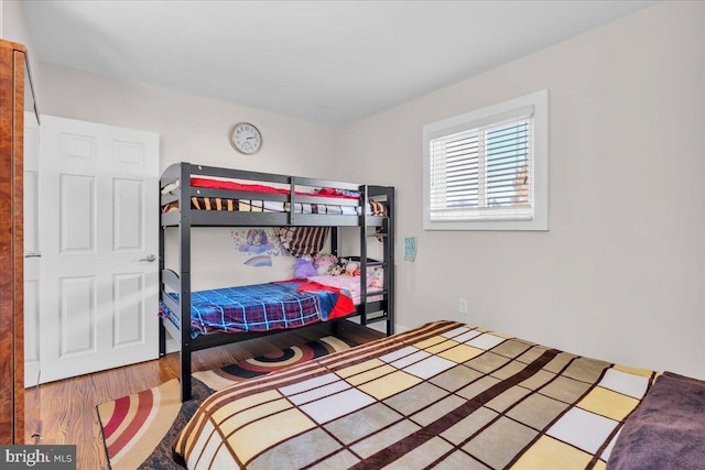 bedroom with hardwood / wood-style flooring