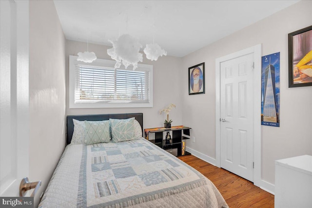 bedroom with wood-type flooring