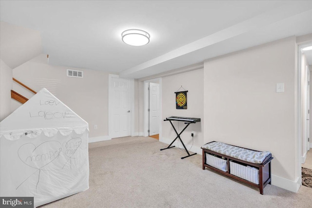 playroom featuring light colored carpet