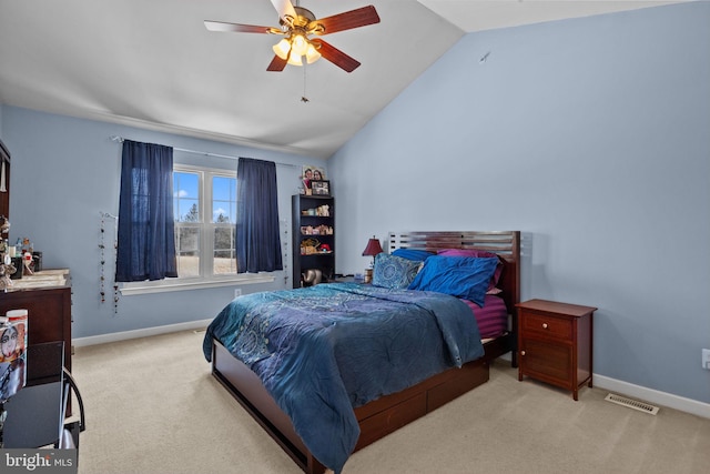 carpeted bedroom featuring ceiling fan and vaulted ceiling