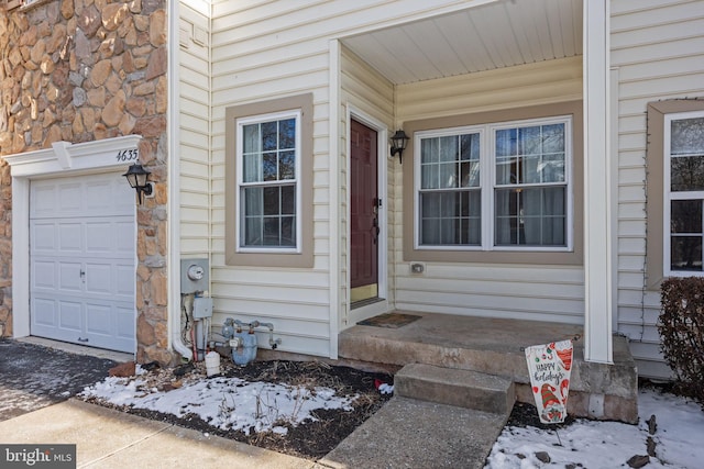 entrance to property featuring a garage