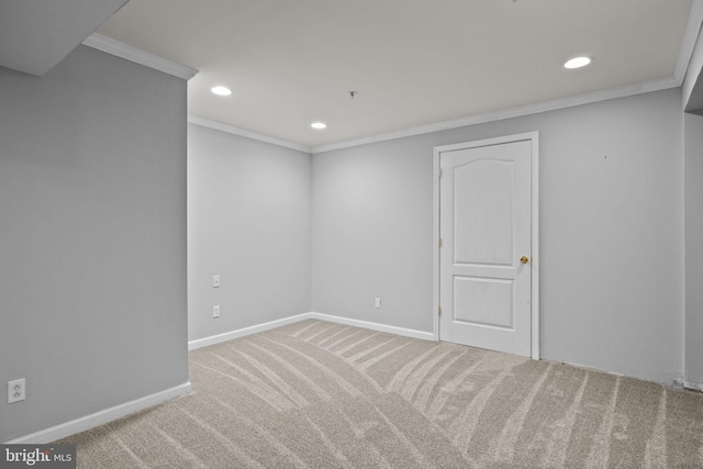 empty room with carpet and crown molding