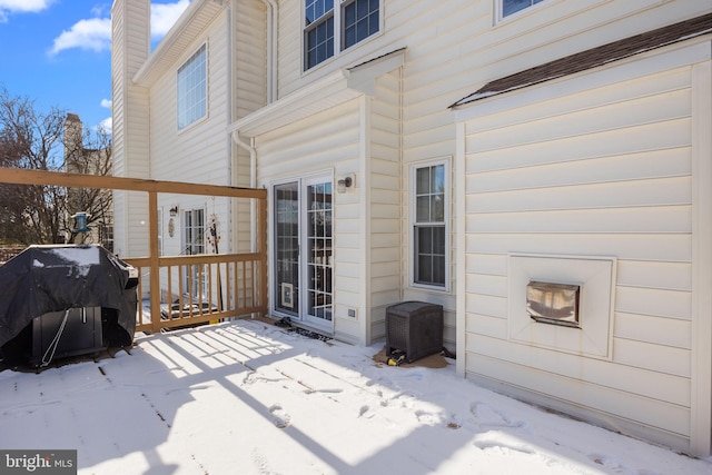 snow covered deck with area for grilling