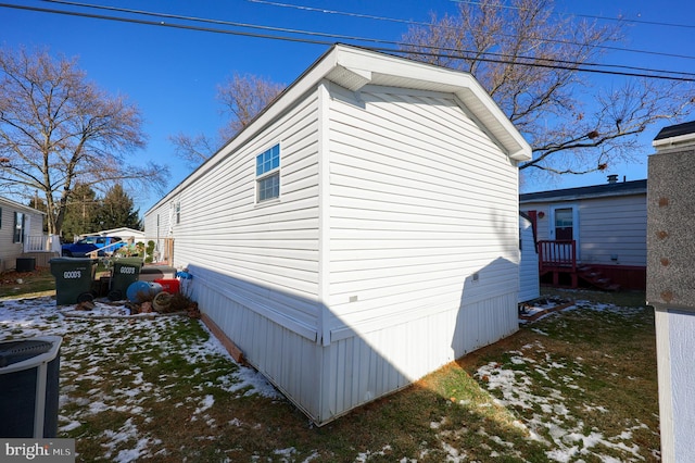 view of side of property with central AC