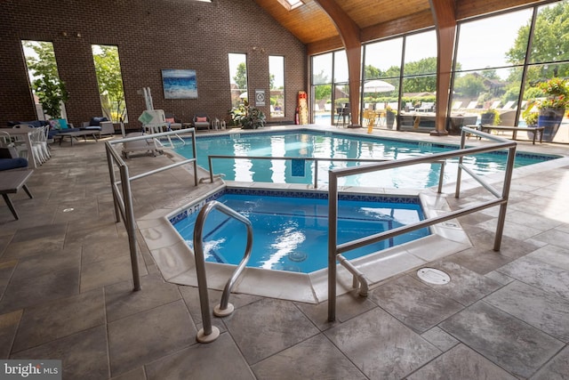 view of pool featuring an indoor hot tub and a patio area