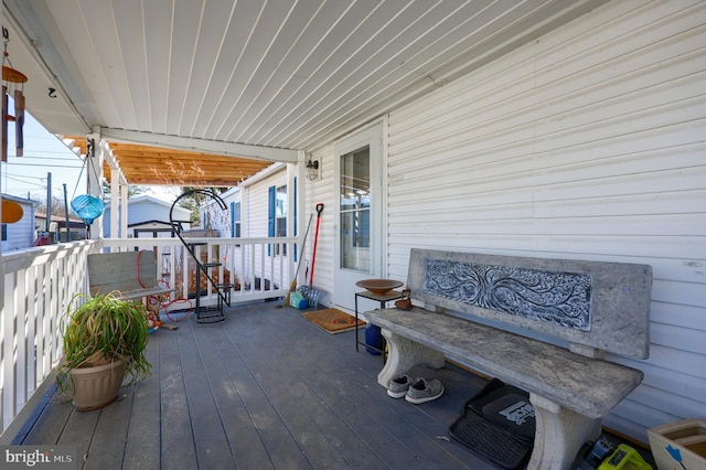 wooden terrace with a porch