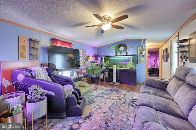 living room featuring crown molding, ceiling fan, plenty of natural light, and vaulted ceiling