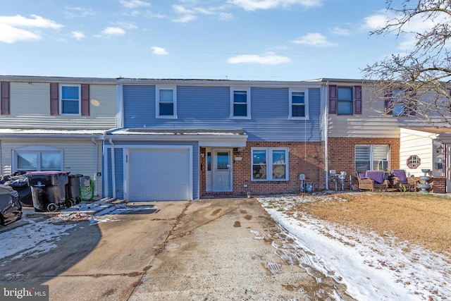 townhome / multi-family property featuring a garage