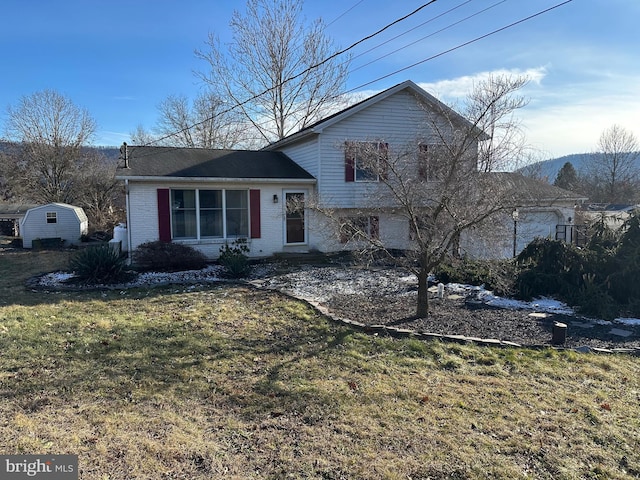 split level home with a front yard