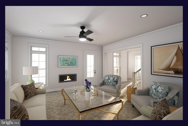 living room featuring ceiling fan, a wealth of natural light, and ornamental molding