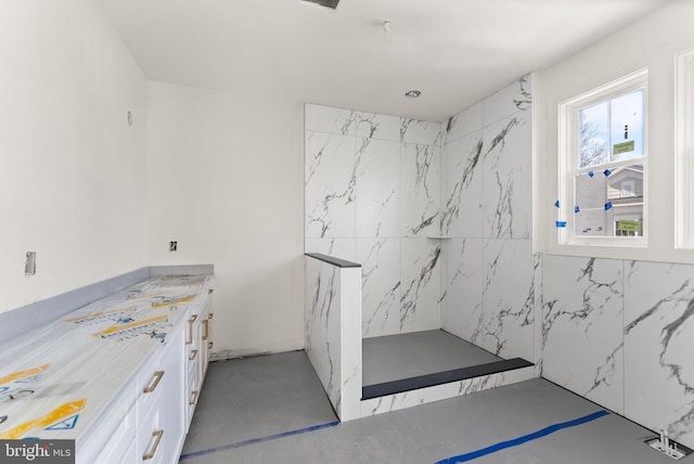 10634 Pocket Pl, Fairfax, VA 22030 - bathroom with a marble finish shower, vanity, and concrete flooring