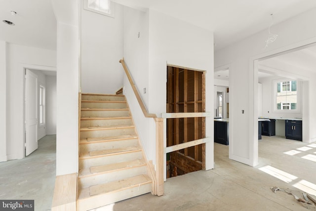 10634 Pocket Pl, Fairfax, VA 22030 - stairway with unfinished concrete floors