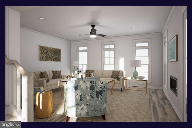 living room featuring ceiling fan, ornamental molding, and wood-type flooring