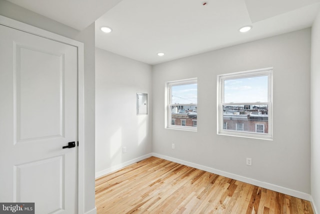 spare room featuring hardwood / wood-style flooring