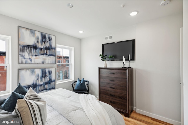 bedroom with light hardwood / wood-style floors