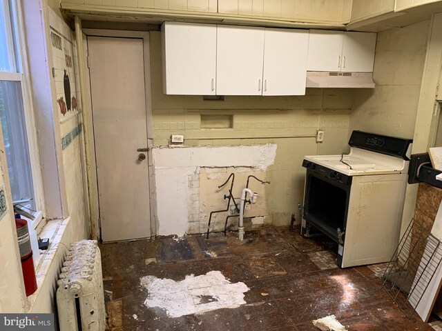 kitchen with white cabinets and stove