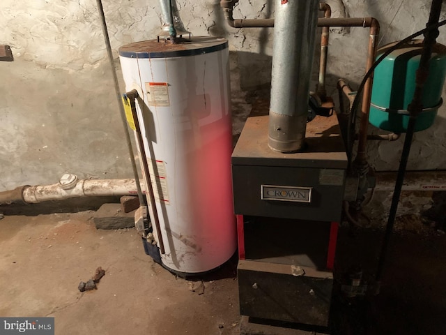 utility room featuring water heater