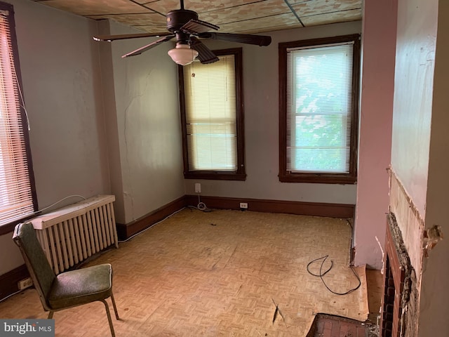 spare room featuring ceiling fan and light parquet flooring