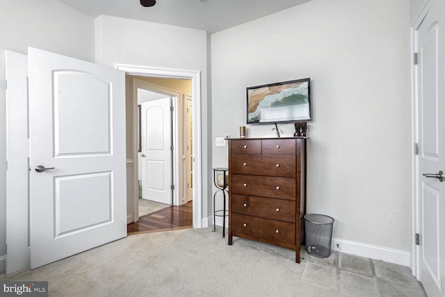 bedroom featuring light carpet