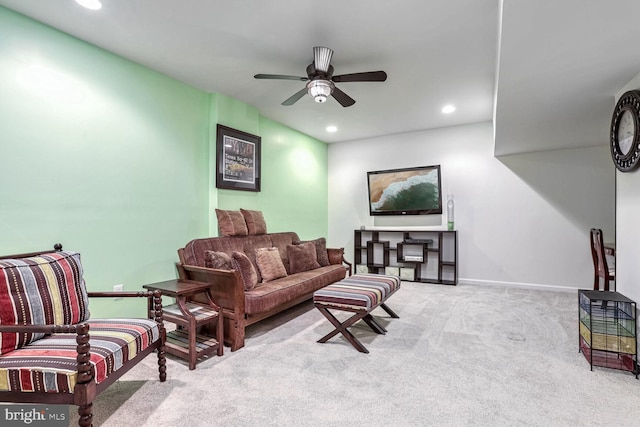 living room featuring ceiling fan and light colored carpet