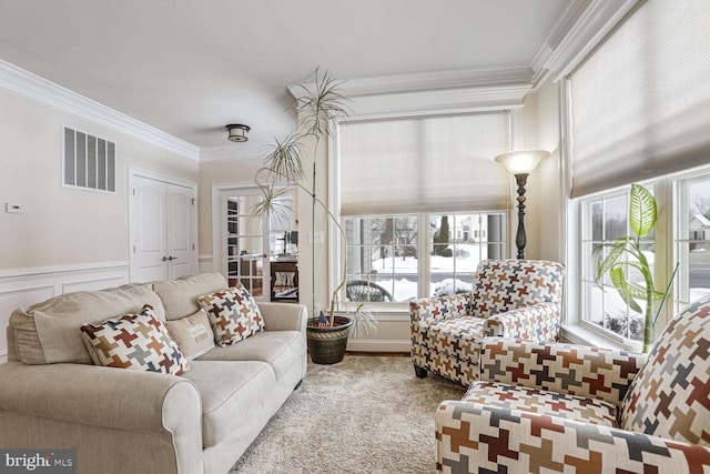 living room with carpet and crown molding