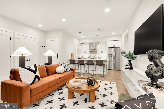 living room featuring light parquet flooring