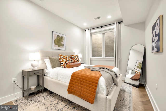 bedroom featuring light parquet flooring