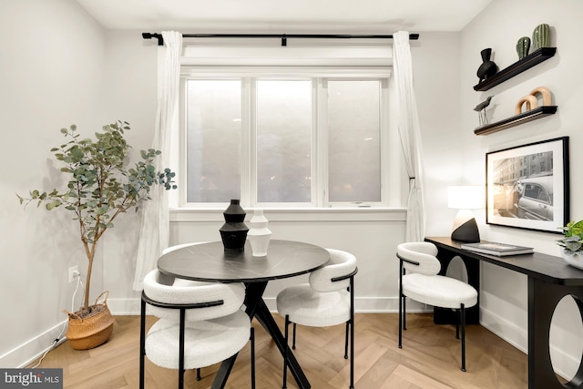 dining area with light parquet floors