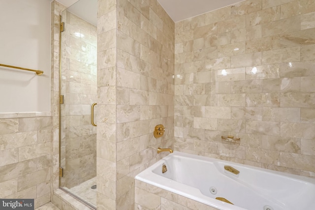 bathroom with separate shower and tub