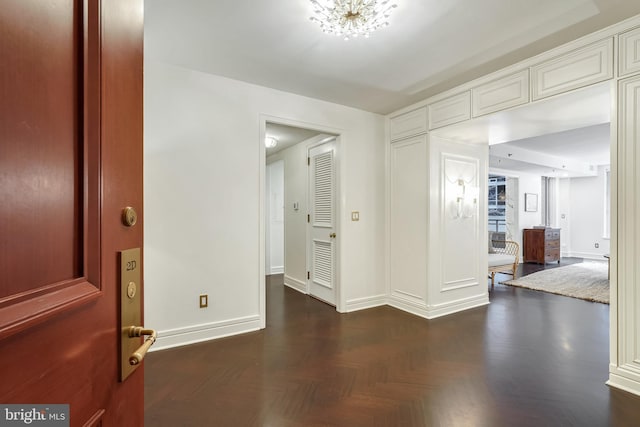 spare room featuring dark parquet floors