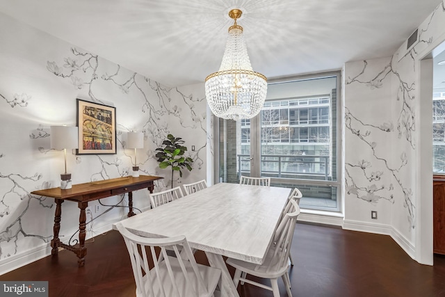 dining space with a notable chandelier