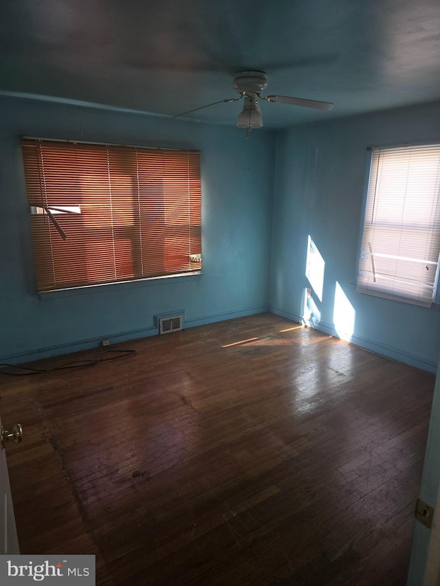 spare room with ceiling fan and hardwood / wood-style floors