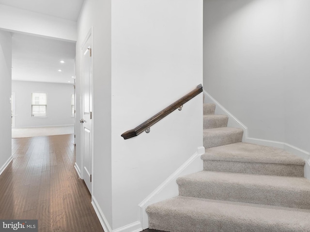 staircase featuring hardwood / wood-style flooring