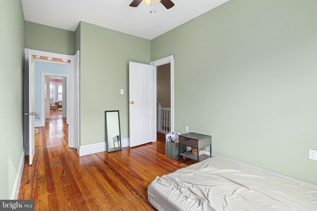 bedroom featuring hardwood / wood-style flooring and ceiling fan