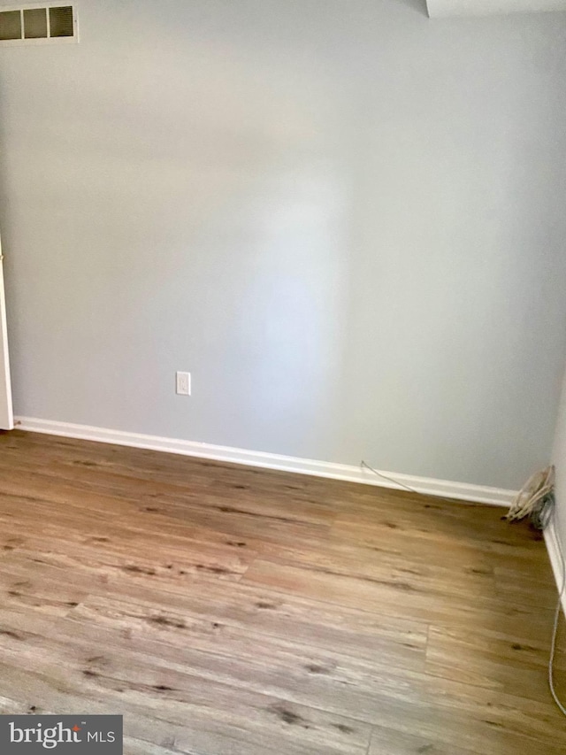 unfurnished room featuring light hardwood / wood-style floors