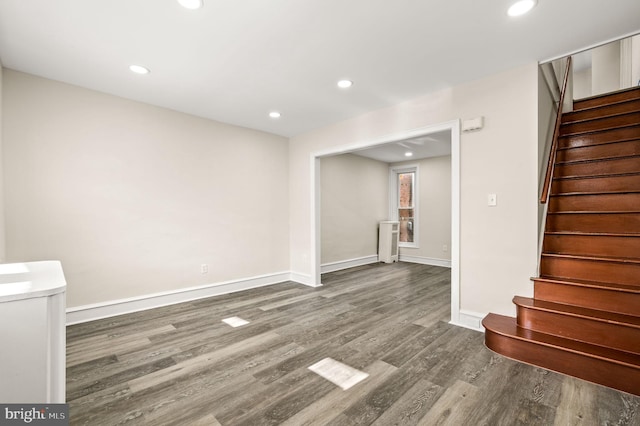 unfurnished living room with wood-type flooring