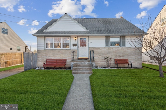 view of front of home with a front yard