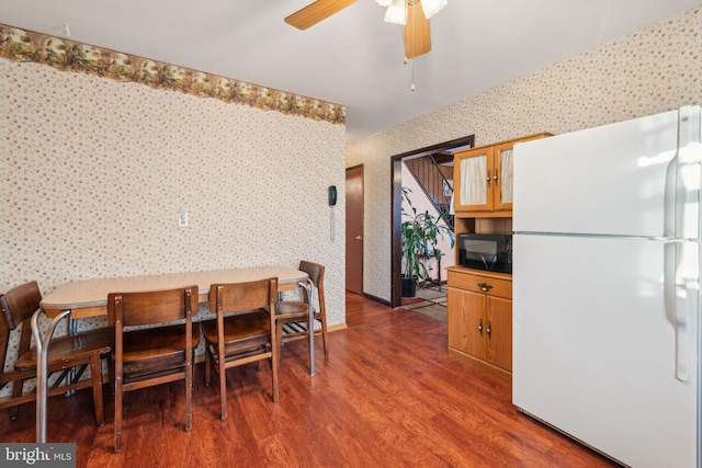 dining room featuring ceiling fan and hardwood / wood-style floors