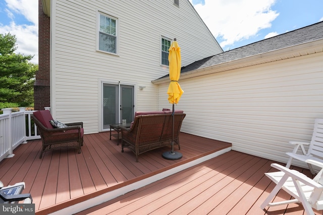 wooden deck featuring outdoor lounge area