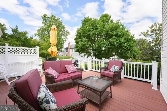 wooden deck featuring an outdoor hangout area